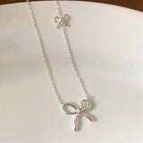 Double Bow Tie Charm Necklace – Sterling Silver
